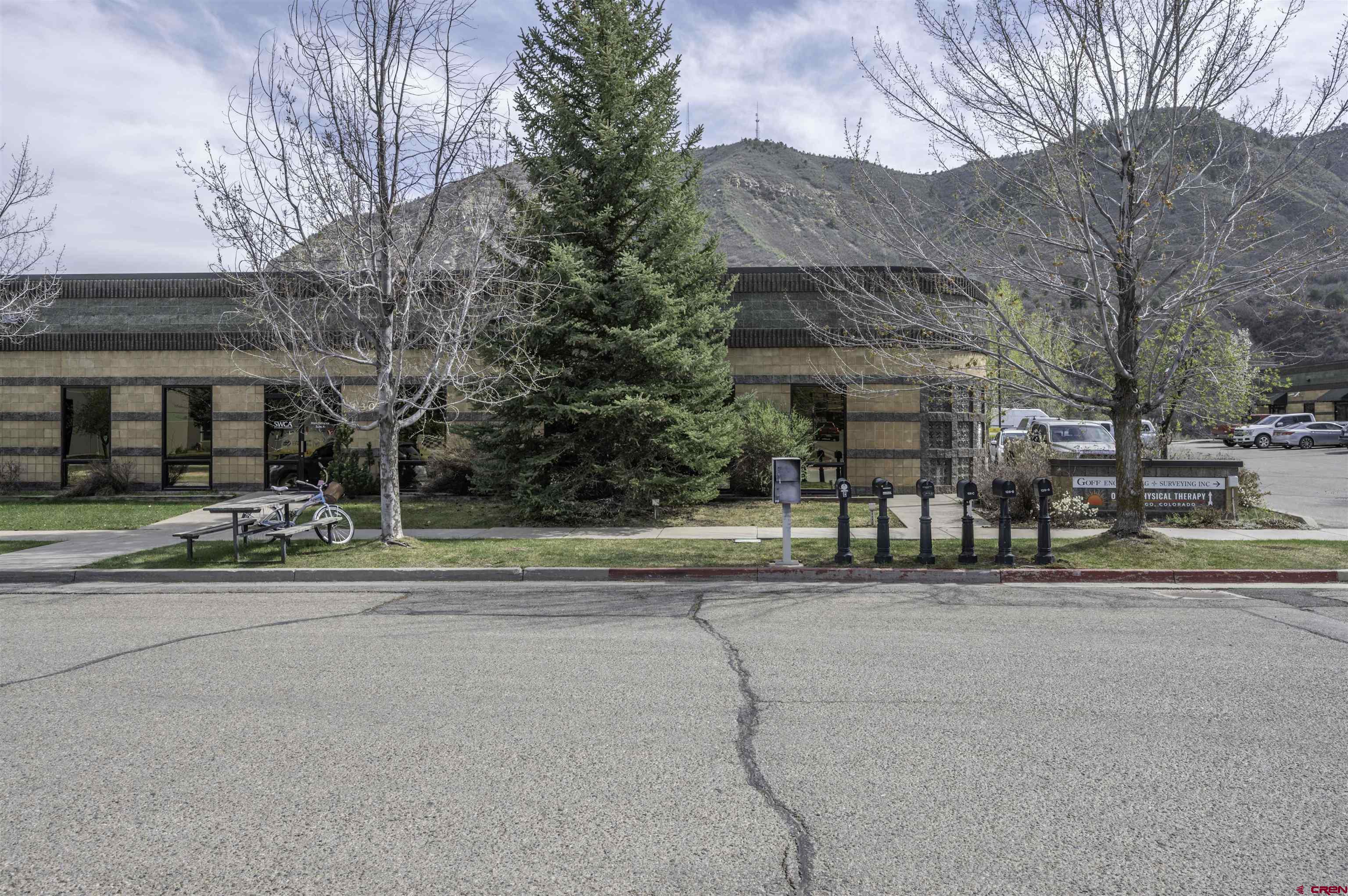 a view of a building with a yard