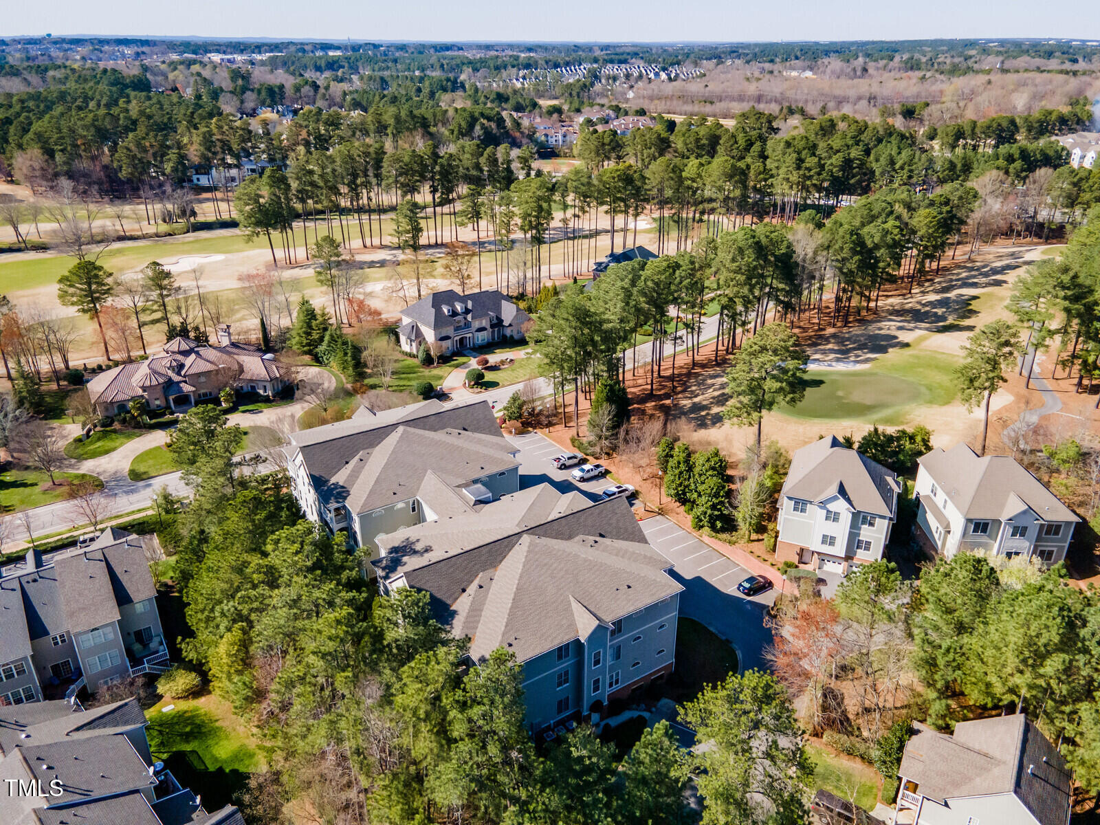 an aerial view of a house with a lake view