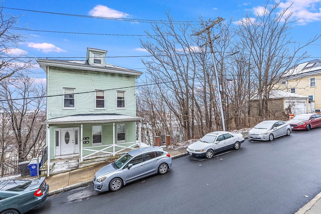 a car parked in front of a house