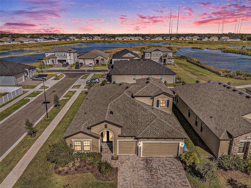 an aerial view of a house with a ocean view