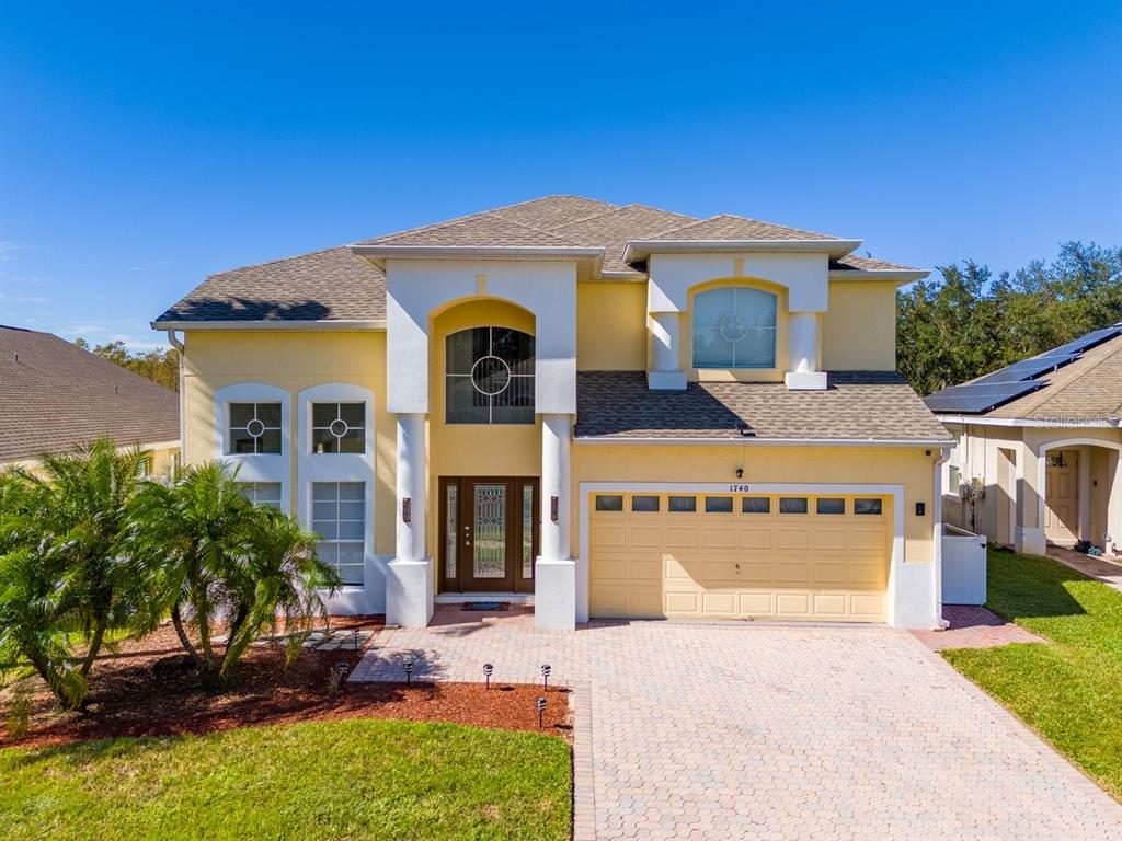 a front view of a house with a yard