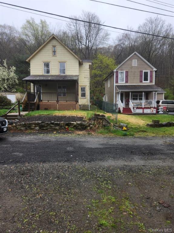 a view of a big house with a street