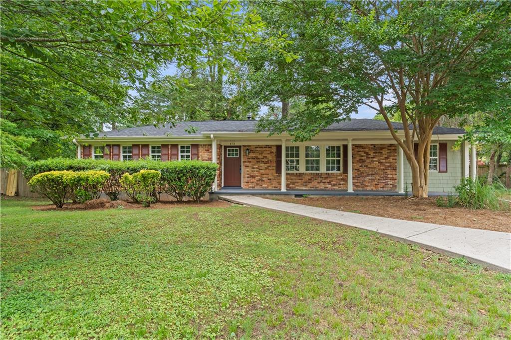 front view of a house with a garden