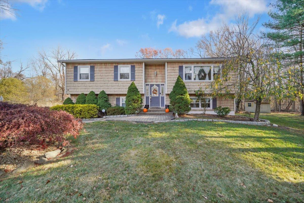 Split foyer home with a front lawn