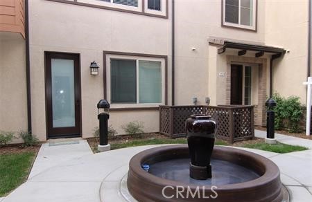 a view of a house with a tub and fire pit