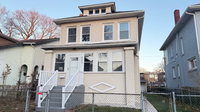 a front view of a house with glass windows