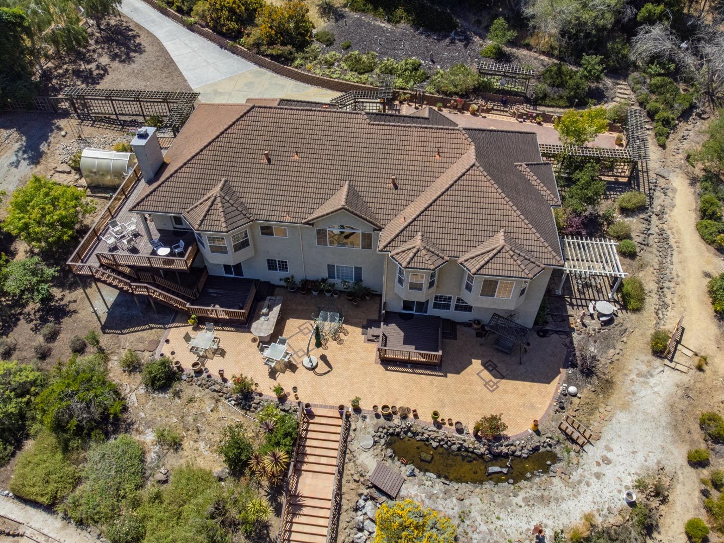 a aerial view of a house with a yard covered in snow