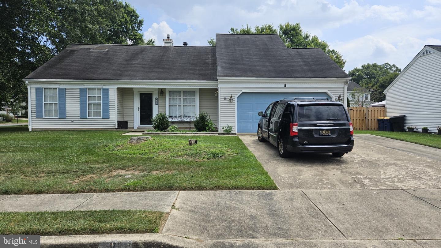 a view of a car parked in front of a house