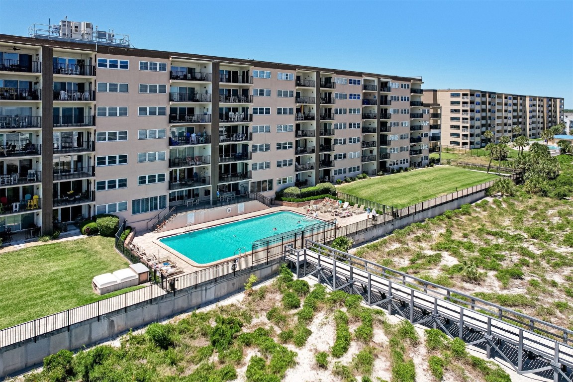 a view of a pool with a yard