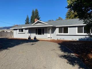 a front view of a house with yard