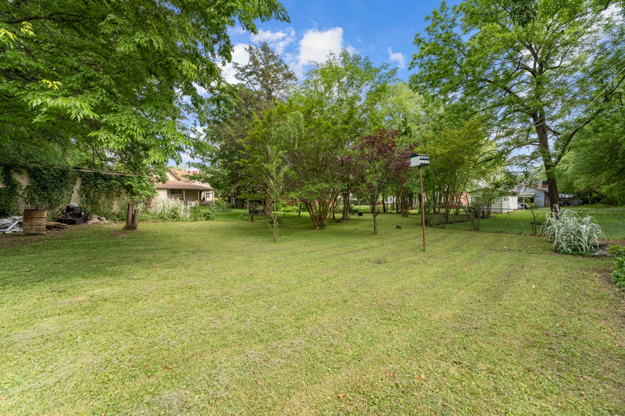 a view of outdoor space with deck and yard