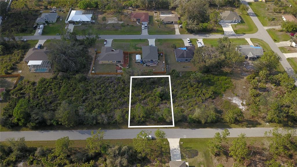 an aerial view of residential house with outdoor space