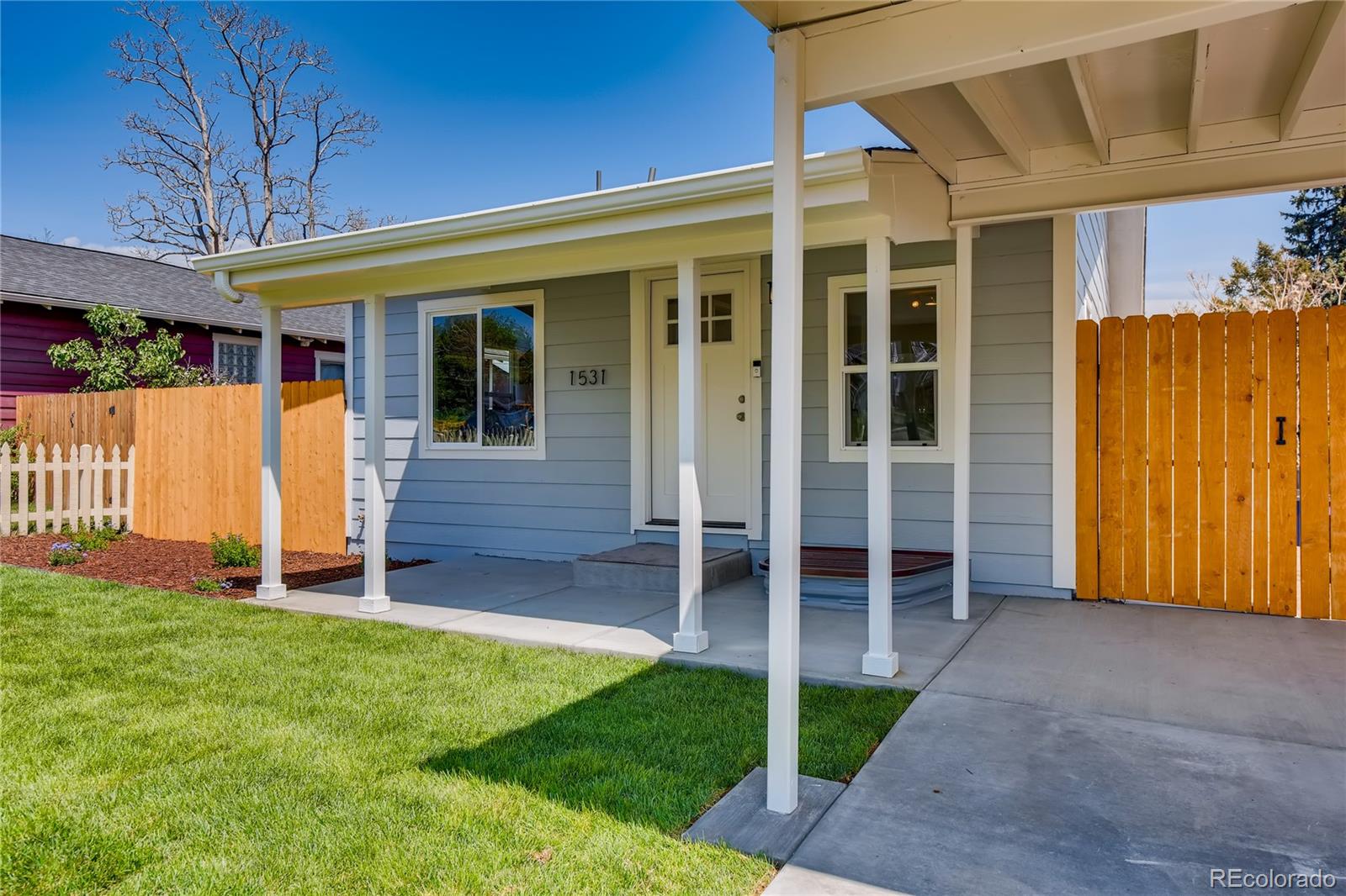 front view of a house with a yard