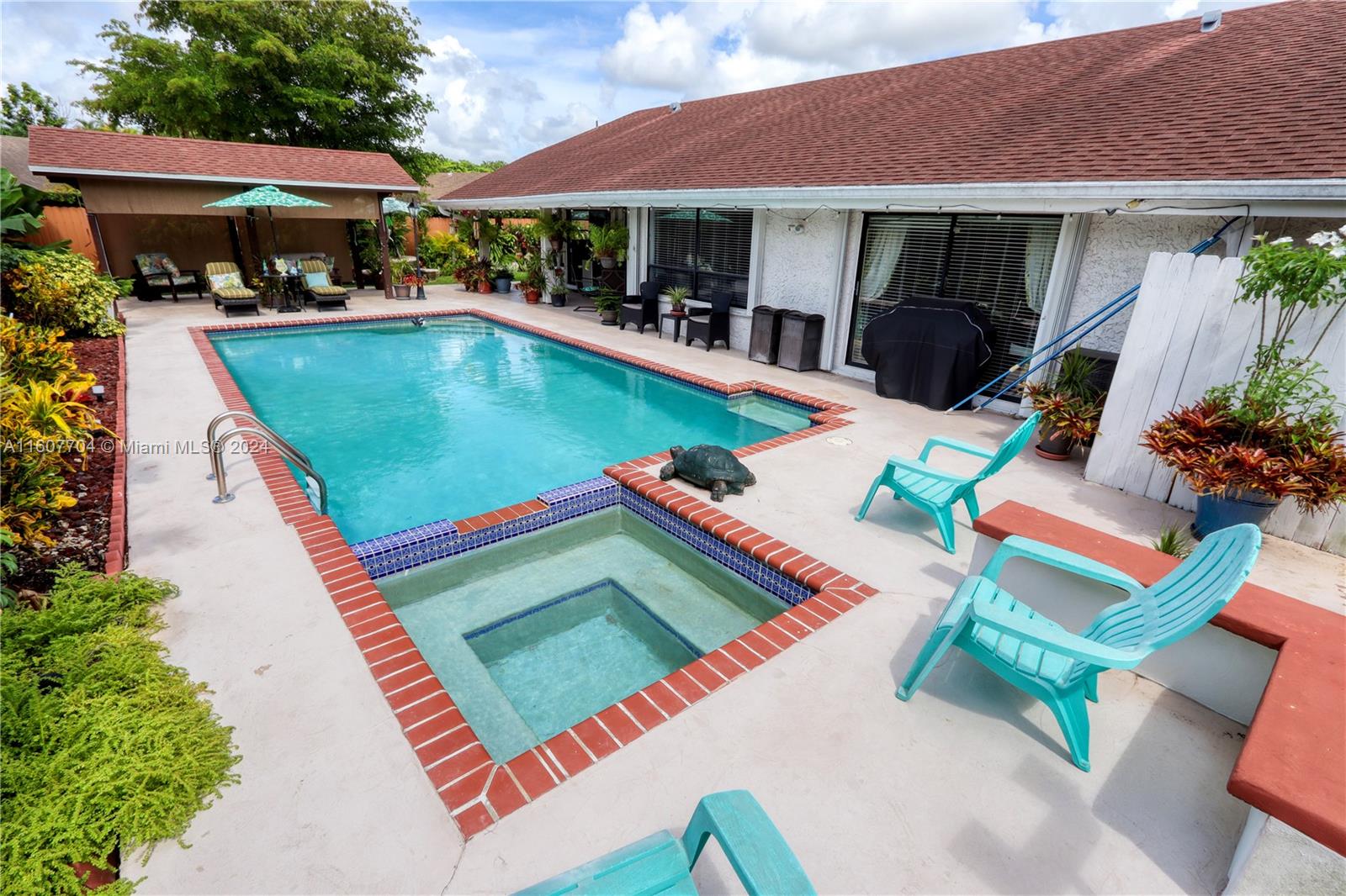 an aerial view of a house with swimming pool patio and balcony