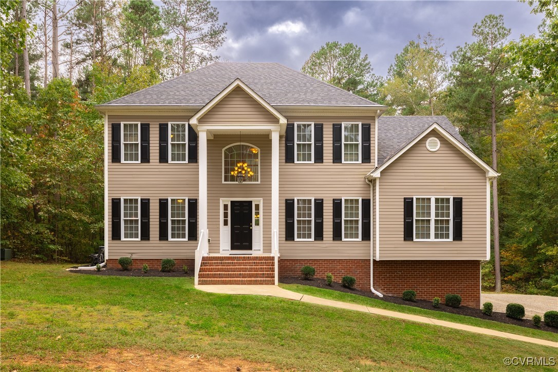 a front view of a house with a yard