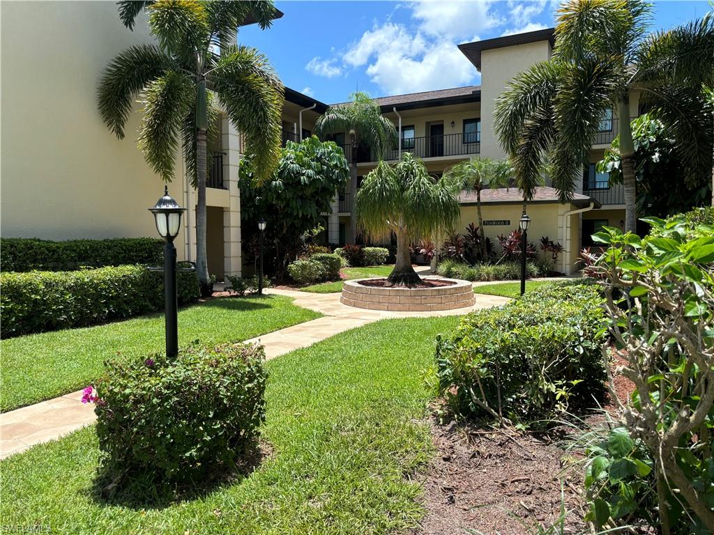 a view of house with yard and outdoor space