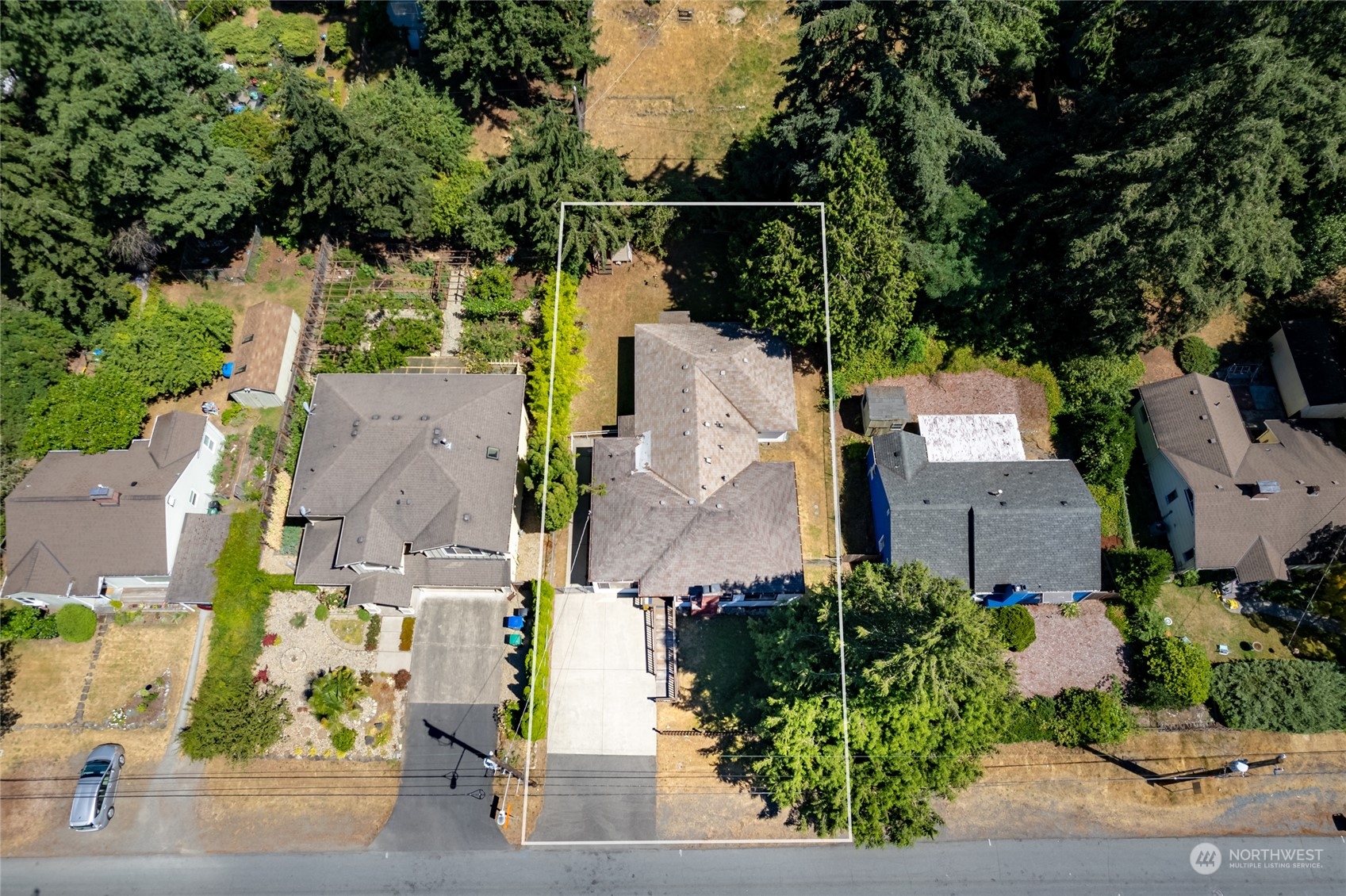 an aerial view of a house with outdoor space