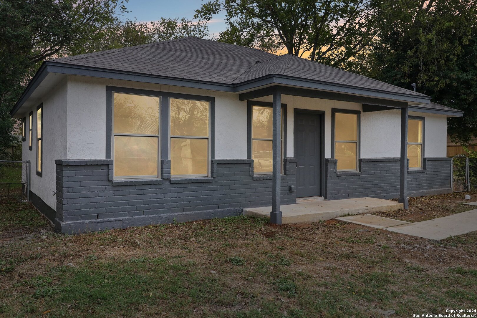 a front view of a house with a yard