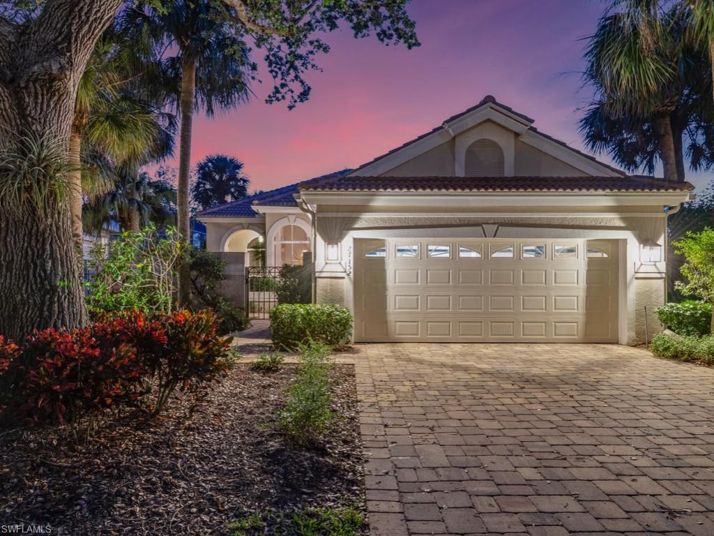 View of front facade featuring a garage