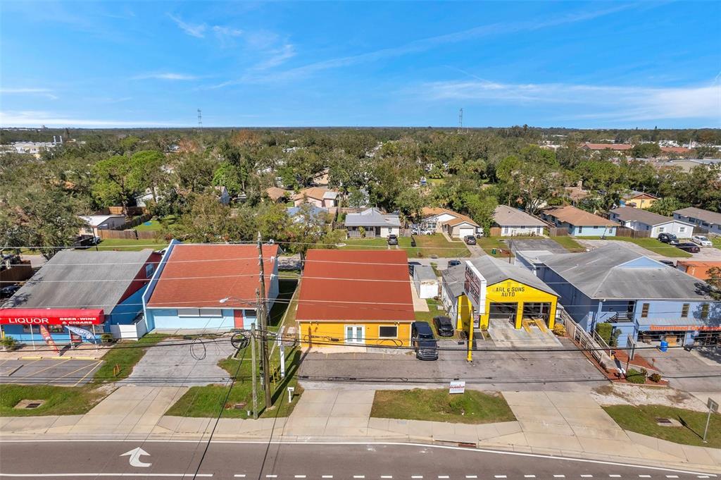 an aerial view of residential houses with city view