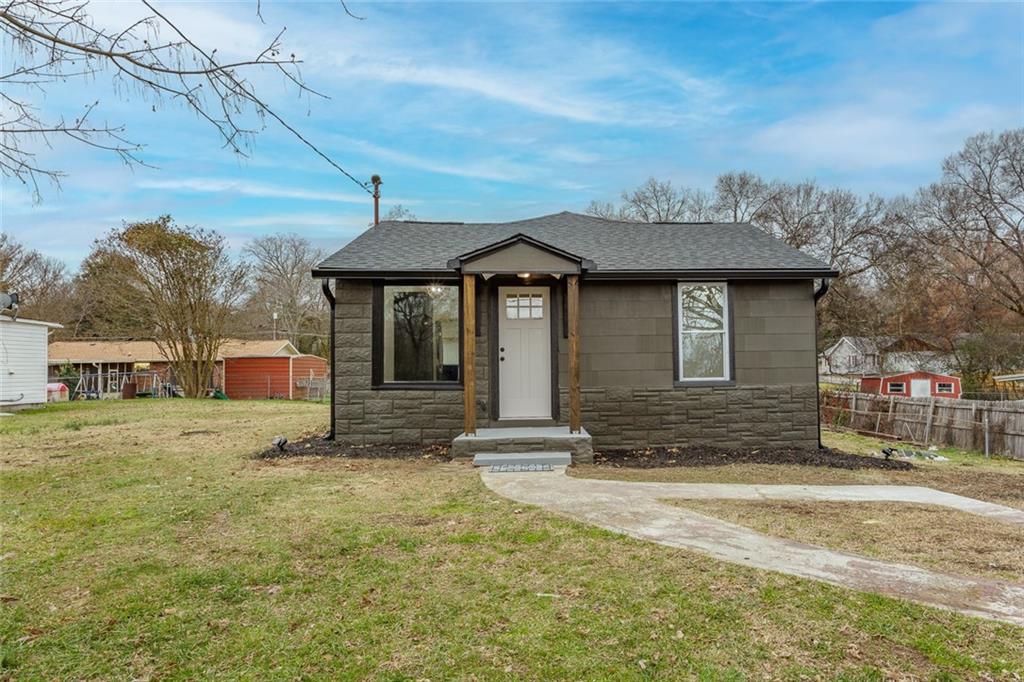 a front view of a house with a yard