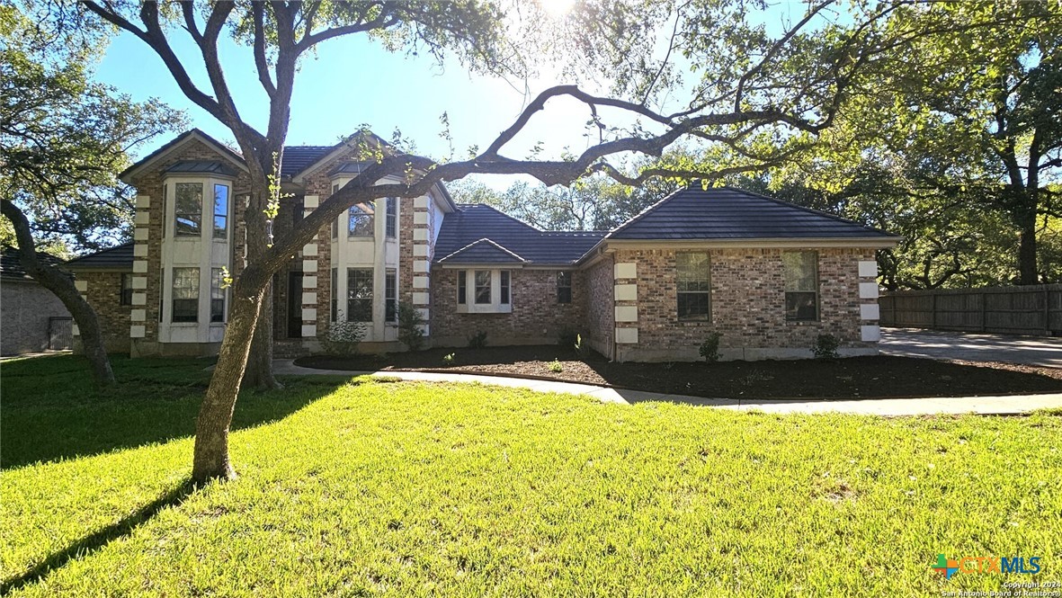 a view of a house with a yard