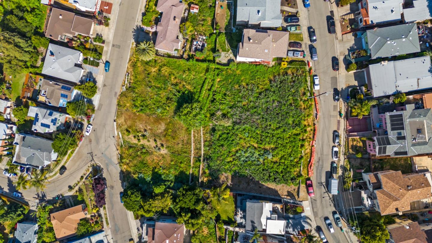 an aerial view of residential houses and trees