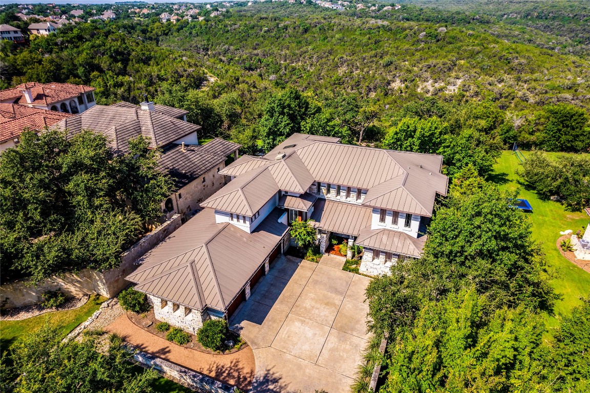 an aerial view of a house with a yard