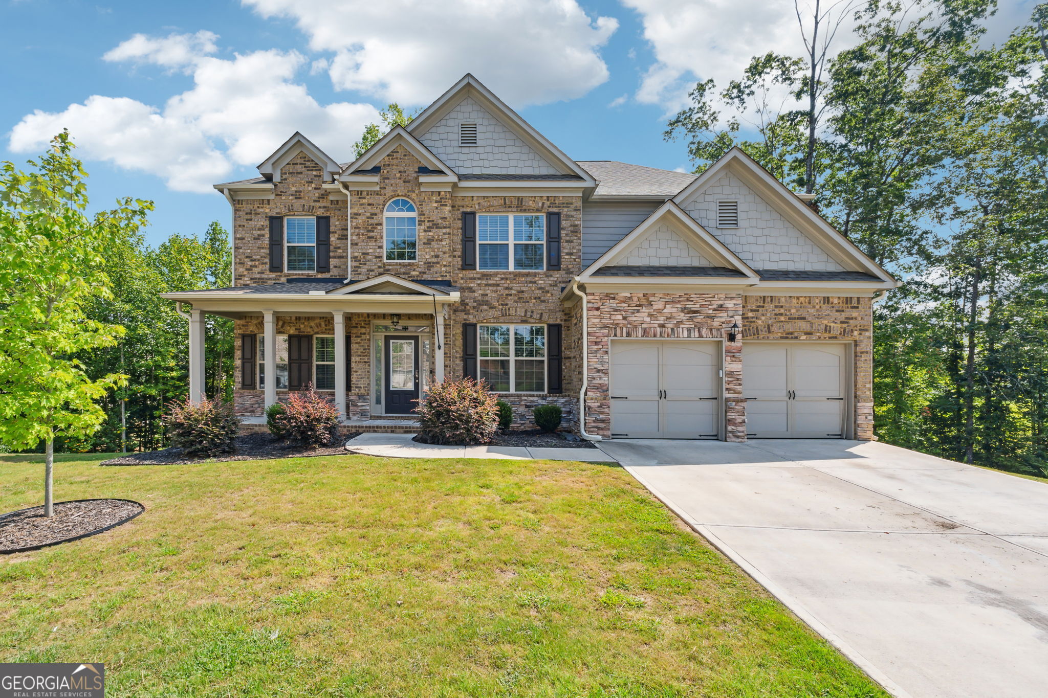 front view of a house with a yard