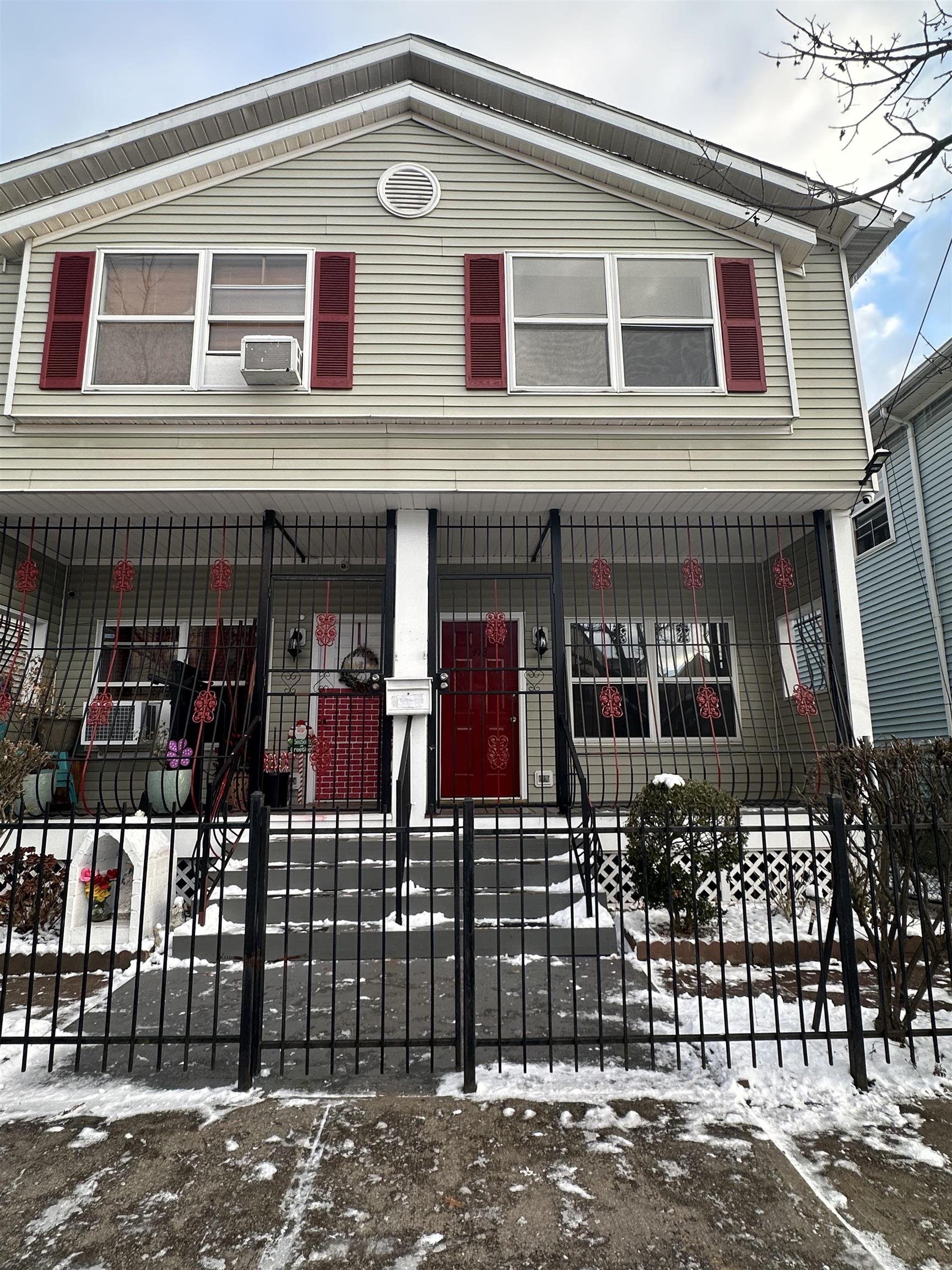 a front view of a house with glass windows