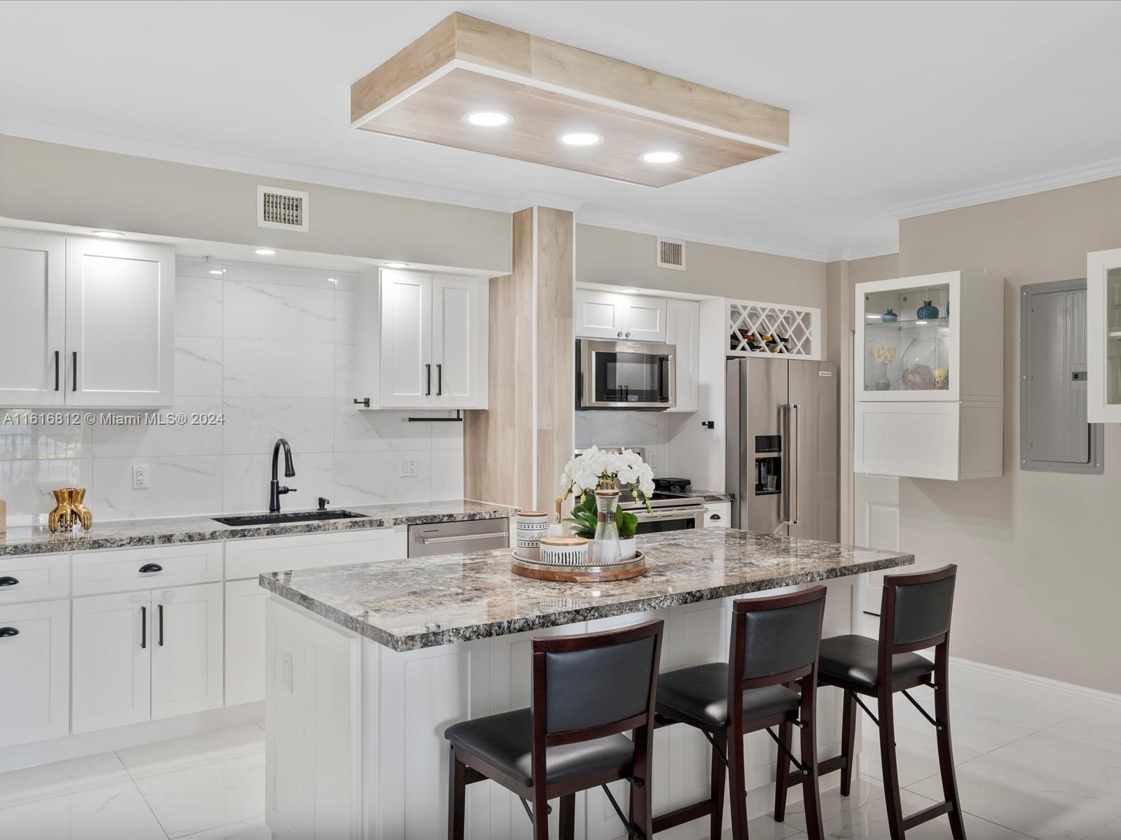 a kitchen with a sink and cabinets