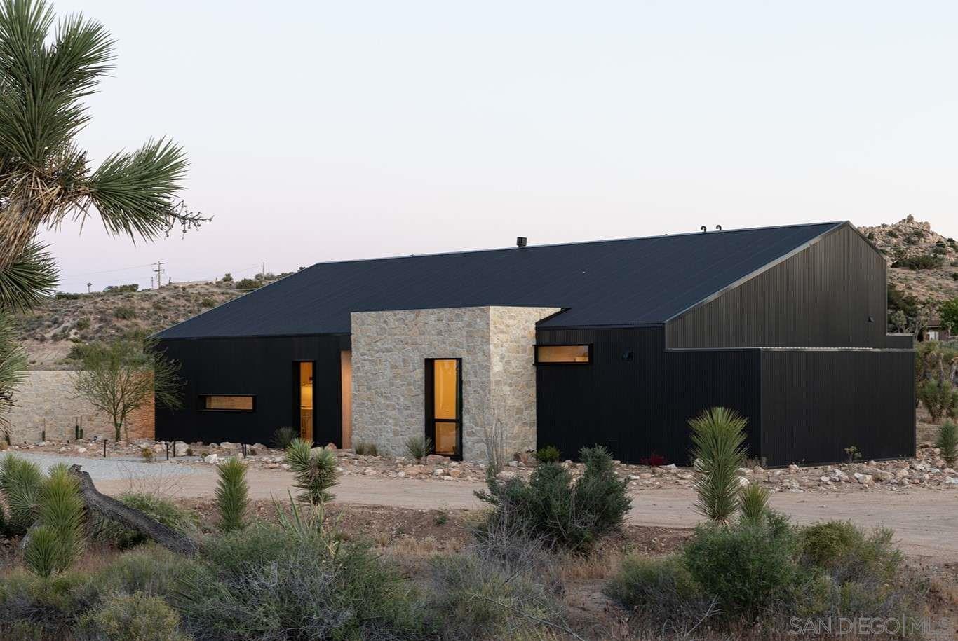 a backyard of a house with seating space