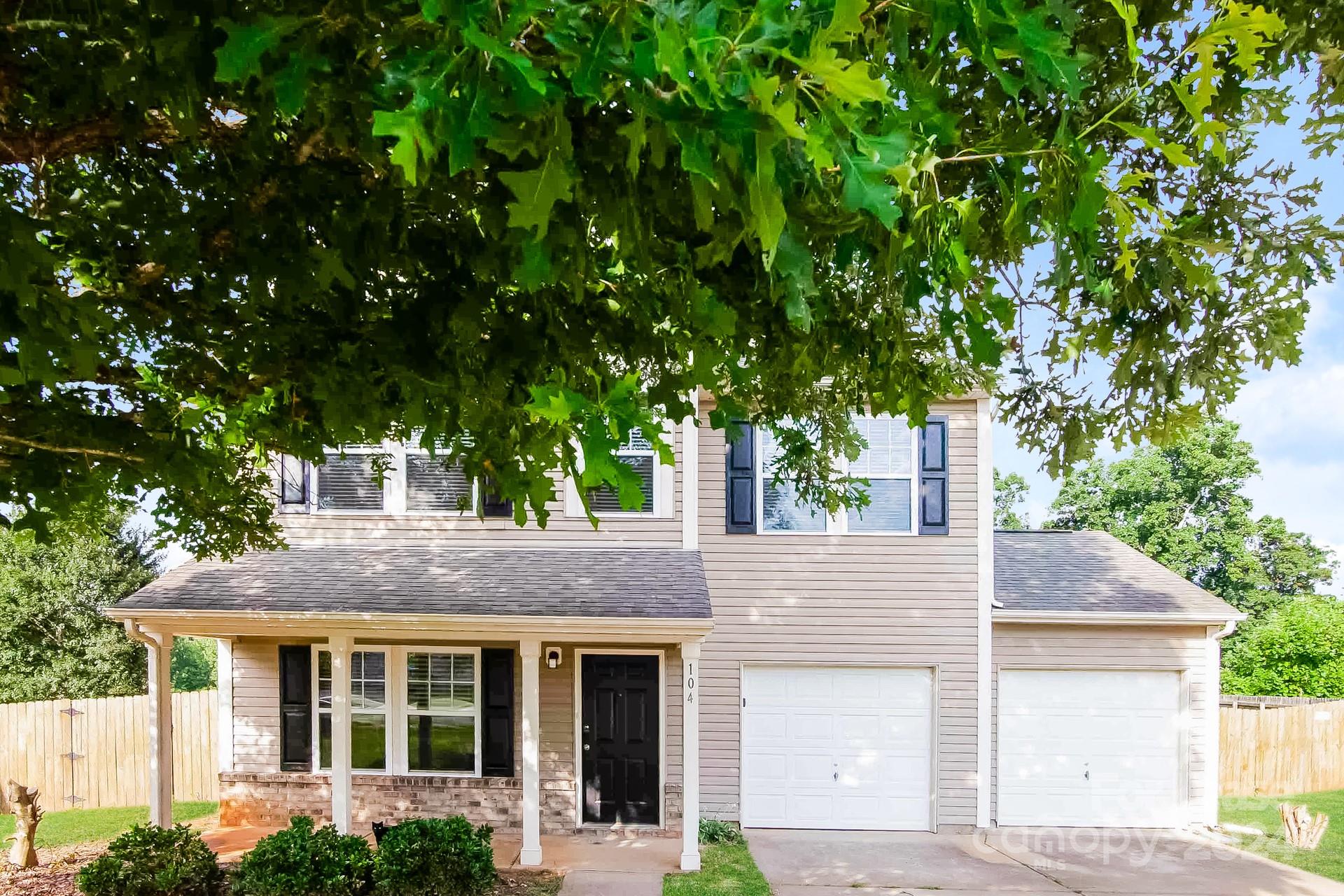 front view of house with a tree