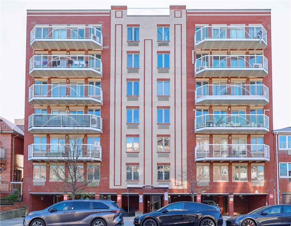 a front view of a multi story residential apartment building