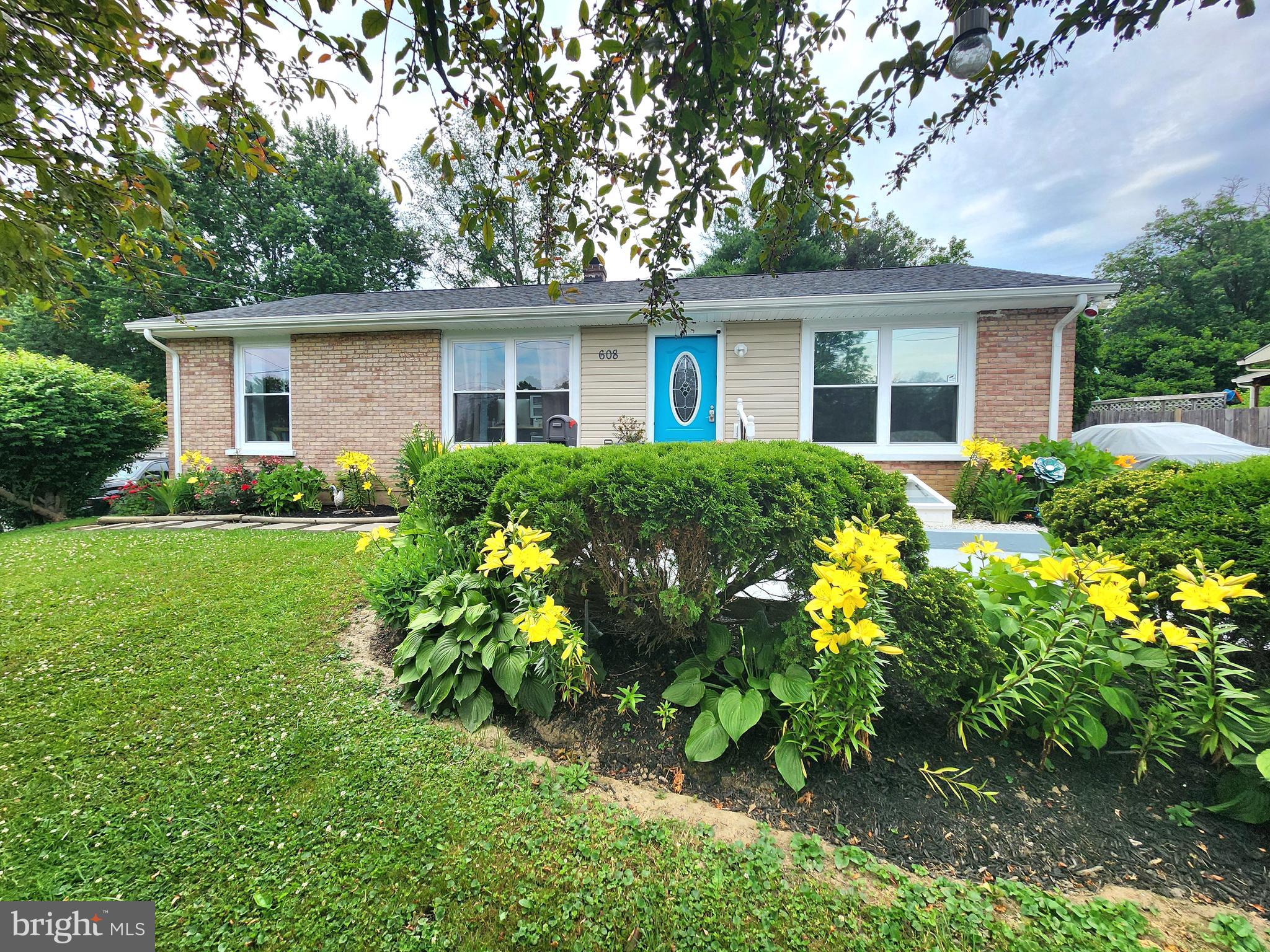 front view of a house with a yard