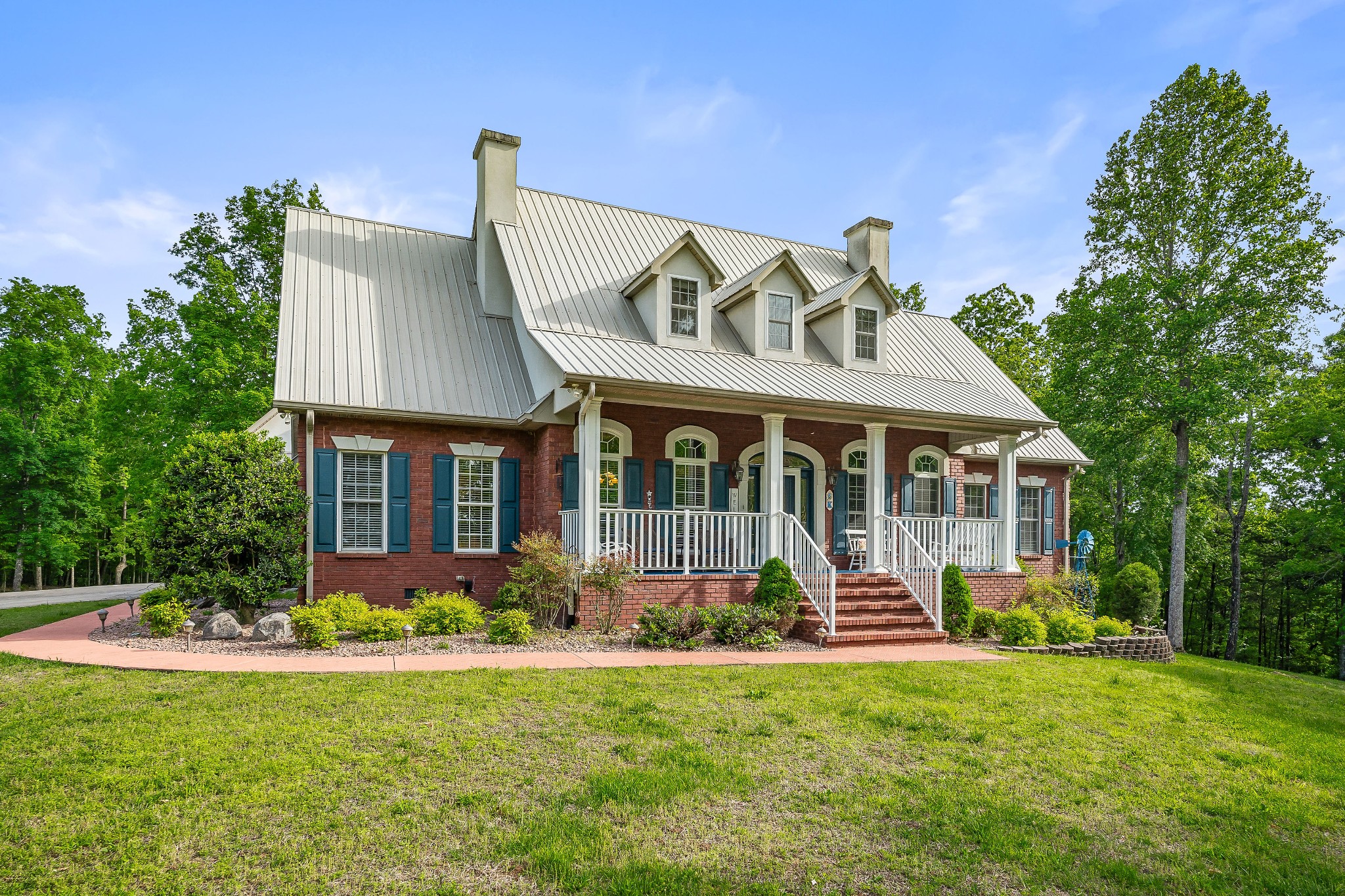 Custom-built and extremely well maintained, this home sits majestically on 5.14 acres and bids you welcome with the lovely covered front porch.