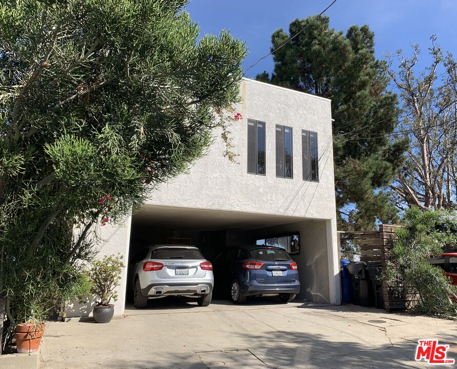 a view of a car parked in front of a building