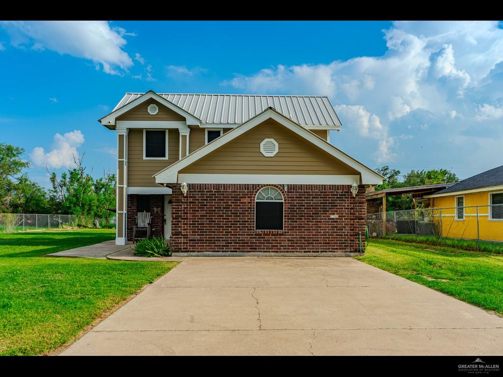 a front view of a house with yard