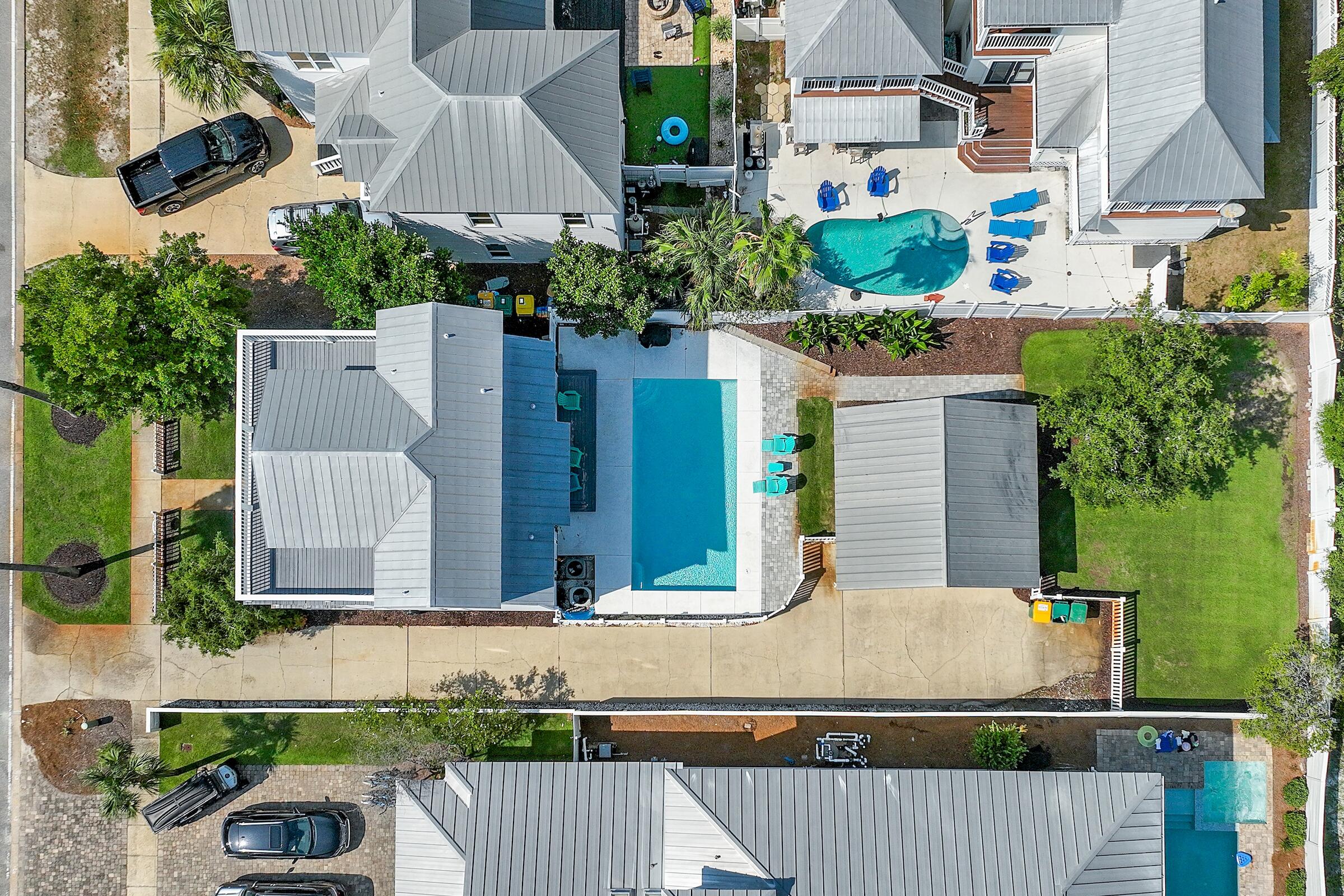 an aerial view of a house with outdoor space