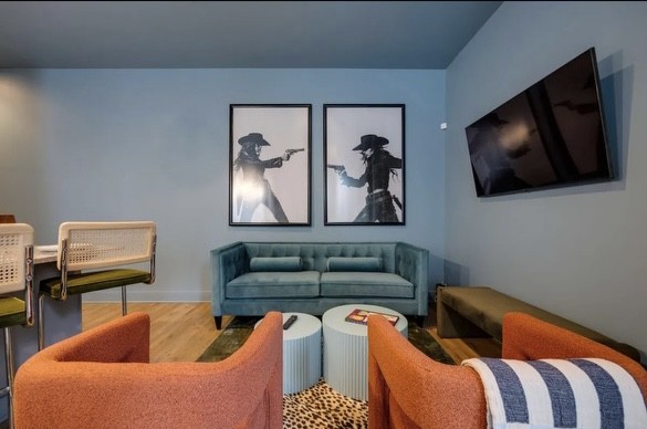 a living room with furniture and a flat screen tv