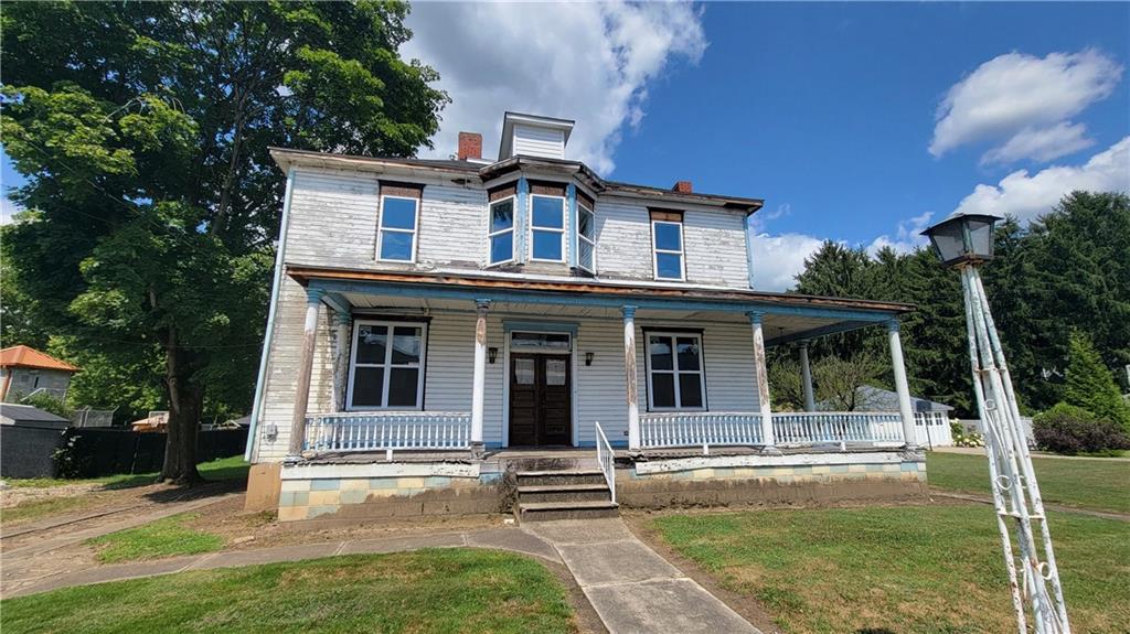 front view of a house with a yard