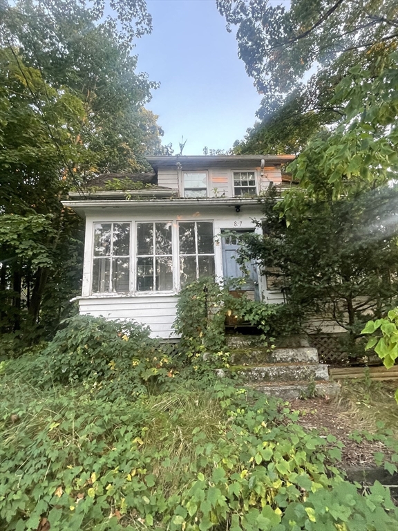 a view of a house with a garden