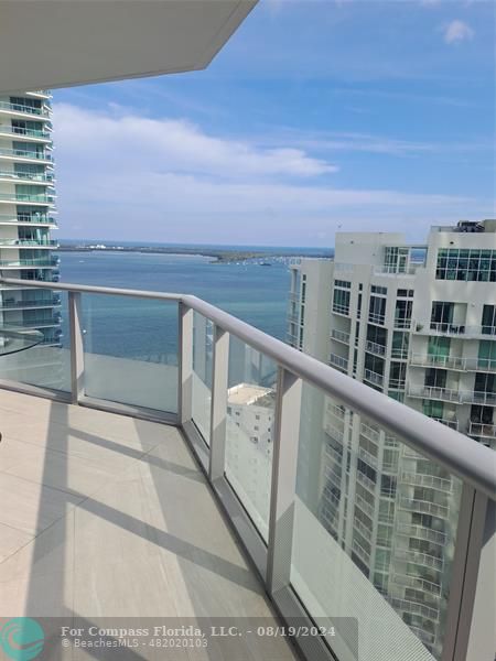 a view of roof with city view