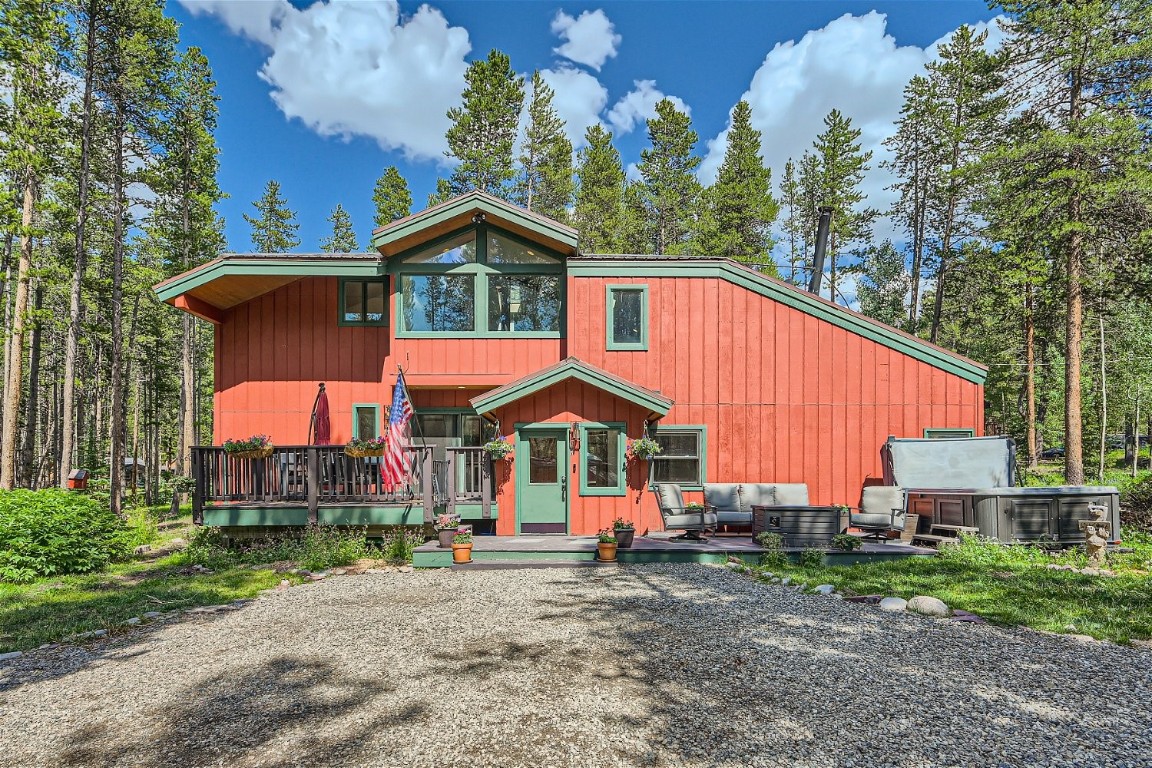 a view of house with backyard