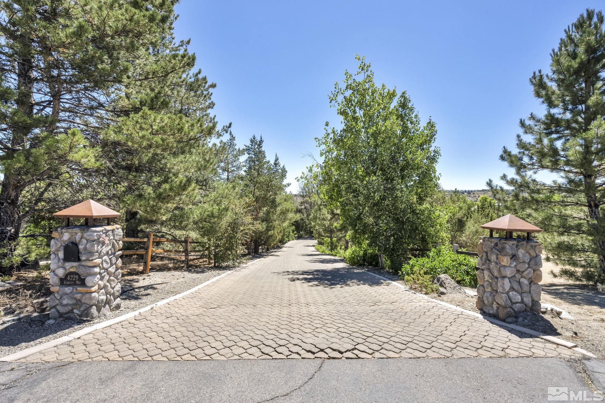 a pathway of a house with a yard