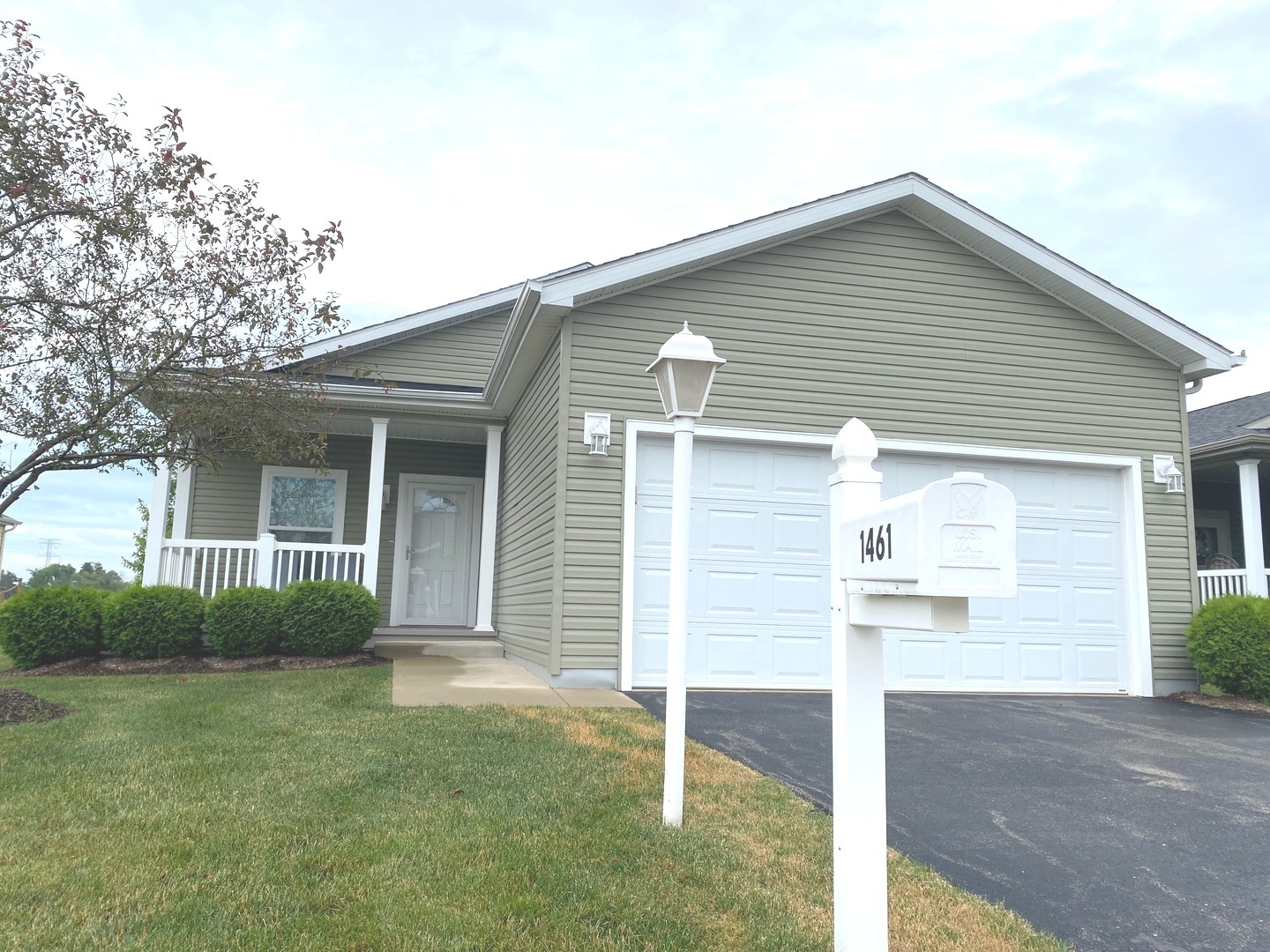 front view of a house and a yard