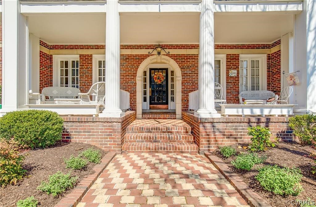 a front view of a house with a outdoor seating