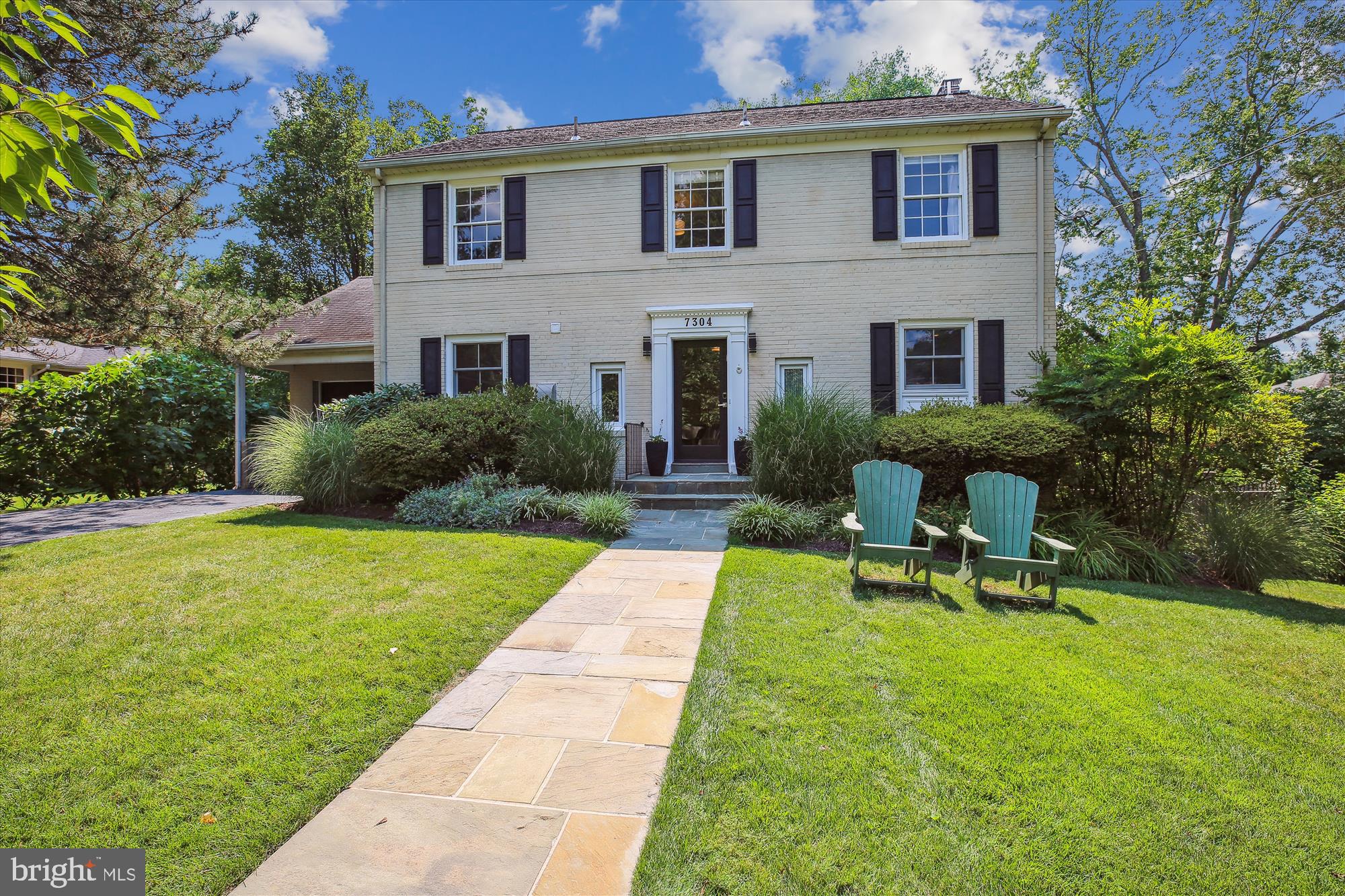 a view of a house with backyard sitting area and garden