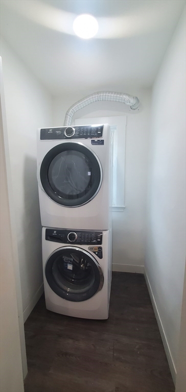 a utility room with washing machine and a sink