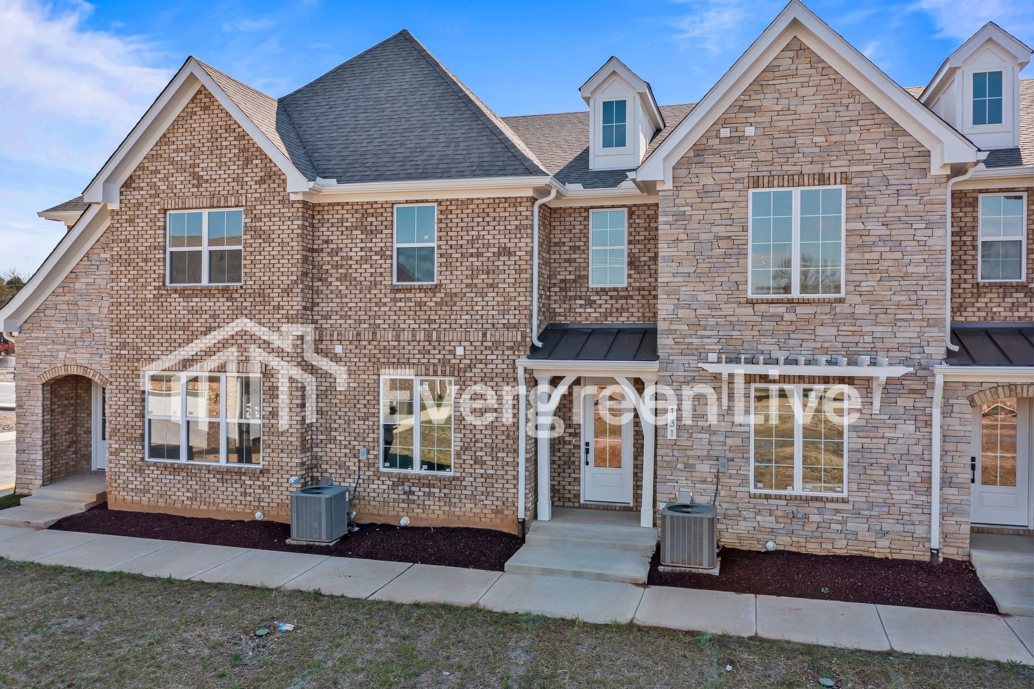 a front view of a house with a yard